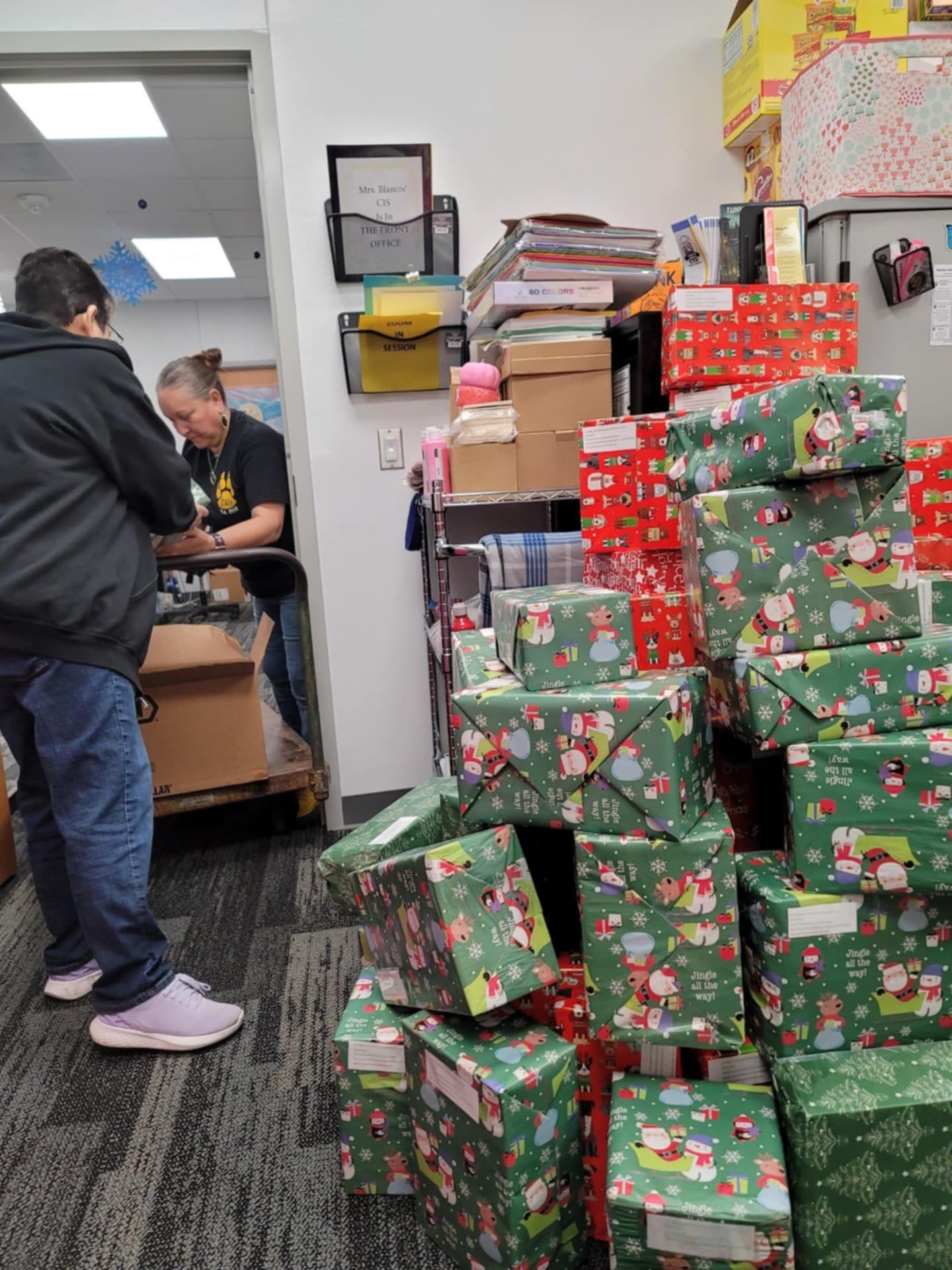 Wrapped Christmas gifts delivered to the school